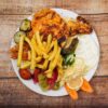 Halbes Hähnchen vom Drehspieß mit Beilage