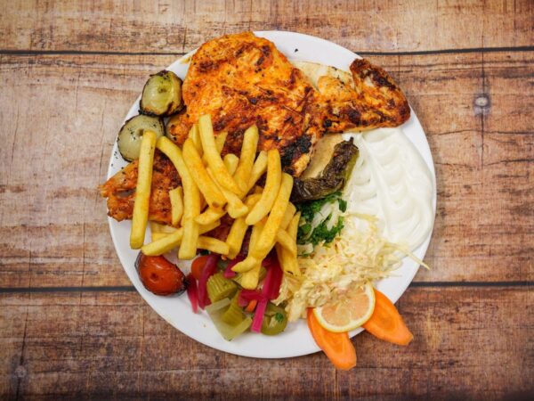 Halbes Hähnchen vom Drehspieß mit Beilage